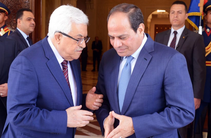A handout picture provided by the PPO shows Egyptian President Abdel Fattah al-Sisi meeting with Palestinian leader Mahmoud Abbas in Cairo on May 9, 2016 (photo credit: AFP PHOTO / PPO / THAER GHANAIM)