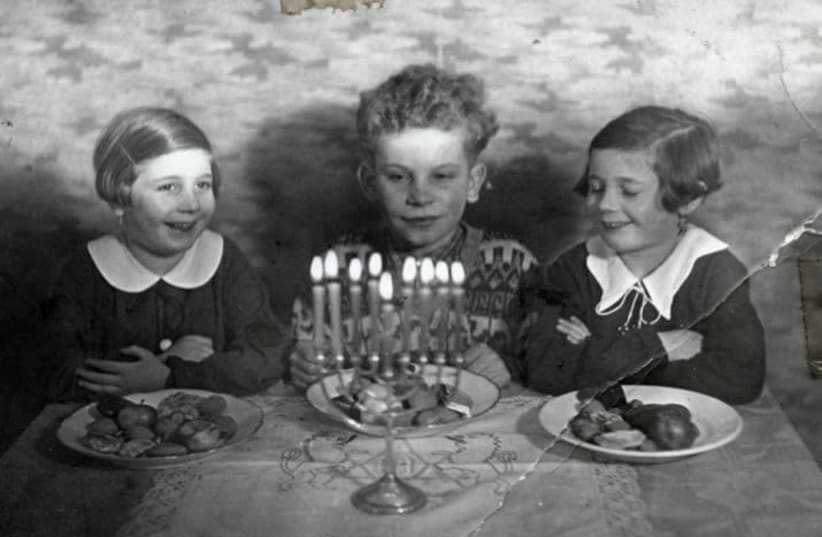 The Raifeld-Welner siblings celebrate Hanukka, 1936 (photo credit: UNITED STATES HOLOCAUST MEMORIAL MUSEUM)