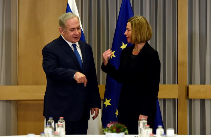 EU foreign policy chief Federica Mogherini meets with Israeli Prime Minister Benjamin Netanyahu at the European Council headquarters in Brussels, Belgium December 11, 2017 (photo credit: REUTERS/ERIC VIDAL)