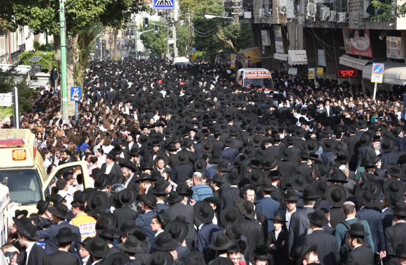 Haredim (ultra-Orthodox) walk through Bnei Brak during the funeral procession of Rabbi Aharon Leib Shteinman. (photo credit: COURTESY ISRAEL POLICE)