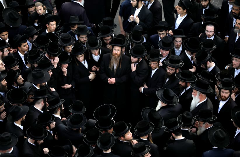Ultra-Orthodox Jews gather during the funeral ceremony of prominent spiritual leader Rabbi Aharon Yehuda Leib Shteinman, who died on Tuesday at the age of 104, in Bnei Brak (photo credit: REUTERS/AMIR COHEN)