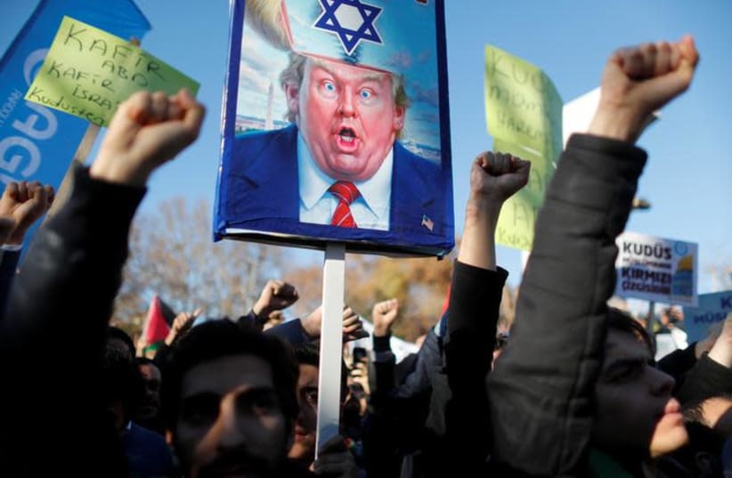 Demonstrators shout slogans during a protest against U.S. President Donald Trump's recognition of Jerusalem as Israel's capital, in Istanbul, Turkey December 8, 2017.  (photo credit: REUTERS/OSMAN ORSAL)