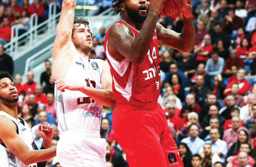 Hapoel Jerusalem requires a perfect display from Richard Howell (in red) & Co. to have any chance of handing Bayern Munich its first Eurocup defeat of the season. (photo credit: DANNY MARON)