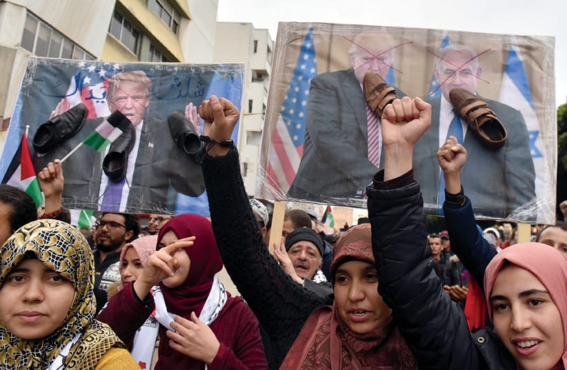 DEMONSTRATORS SHOUT slogans during a protest against the US intention to move its embassy to Jerusalem and to recognize the city of Jerusalem as the capital of Israel, in the city of Rabat, Morocco, earlier this week (photo credit: REUTERS)
