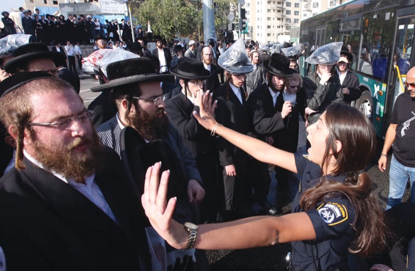 Haredi rioters affiliated with extremist communities block traffic at a Jerusalem junction (photo credit: MARC ISRAEL SELLEM)