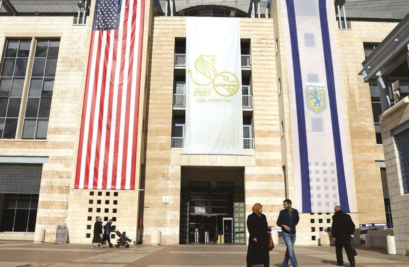  US AND Israel flags displayed in Jerusalem after Washington recognized Jerusalem as the capital. (photo credit: REUTERS)