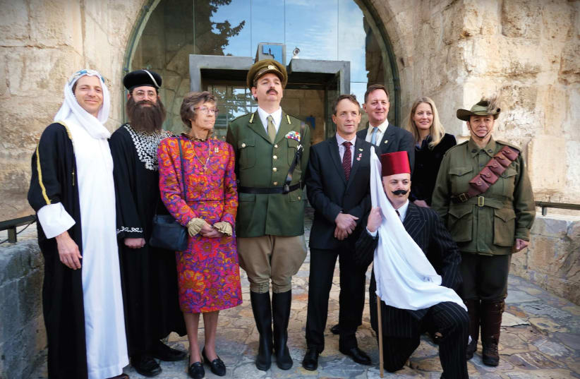 THE CURRENT Lord Allenby and his mother, Sara Viscountess Allenby, pose for a photo with actors at the reenactment of Allenby’s entrance into the Old City of Jerusalem, along with John Benson and his wife, Christina, in the back row. (photo credit: BARRY LEVINSON)