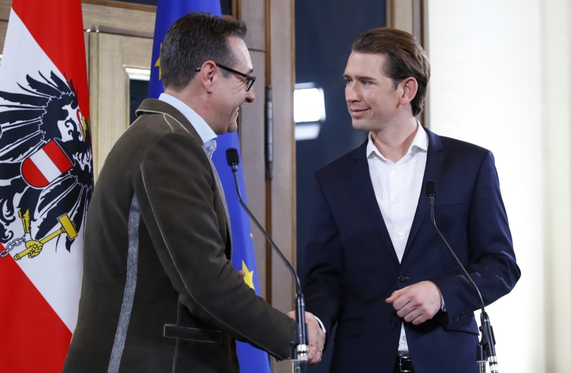 Head of the Freedom Party (FPOe) Heinz-Christian Strache (L) and head of the People's Party (OeVP) Sebastian Kurz shake hands at the end of a news conference in Vienna, Austria, December 15, 2017. (photo credit: REUTERS)