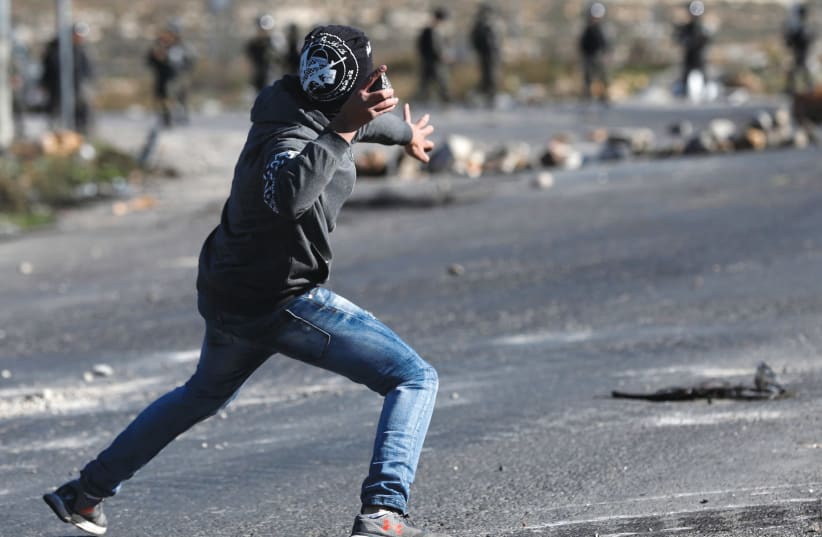 ‘TERRORISTS LOB rocks more than two-dozen times per day at Israeli vehicles driving on Highway 60, the main north-south highway that runs through the hills of Samaria.’  (photo credit: REUTERS)