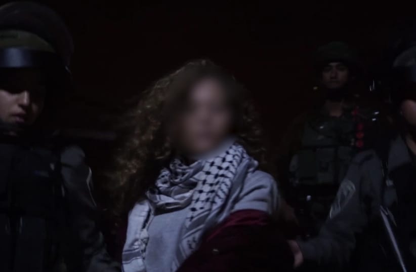 Palestinian teenager Ahed Tamimi is arrested by Israeli security forces, December 19, 2017 (photo credit: IDF SPOKESPERSON'S UNIT)