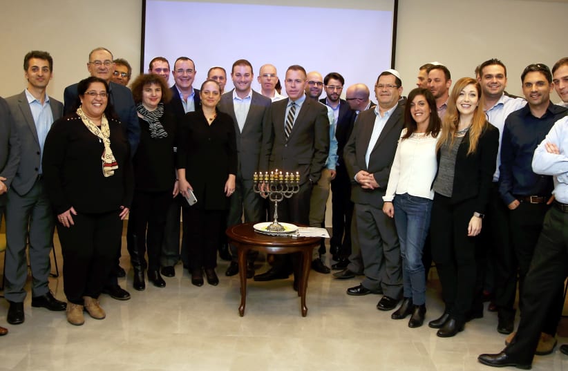 Strategic Affairs Minister Gilad Erdan lights candles with anti-BDS activists from Jewish organizations (photo credit: COURTESY MINISTRY OF STRATEGIC AFFAIRS)