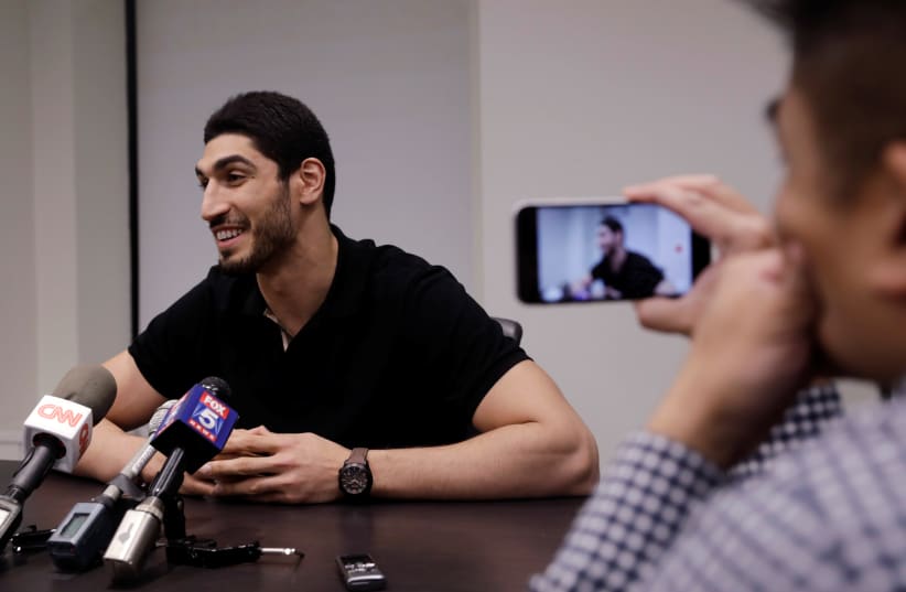 Turkish NBA player Enes Kanter speaks about the revocation of his Turkish passport and return to the United States at National Basketball Players Association headquarters in New York, US. (photo credit: REUTERS)