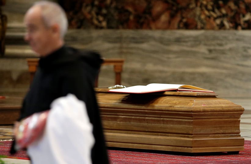 Coffin of the former Archbishop of Boston Cardinal Bernard Law is seen before the funeral in St. Peter's Basilica at the Vatican, December 21, 2017 (photo credit: MAX ROSSI / REUTERS)