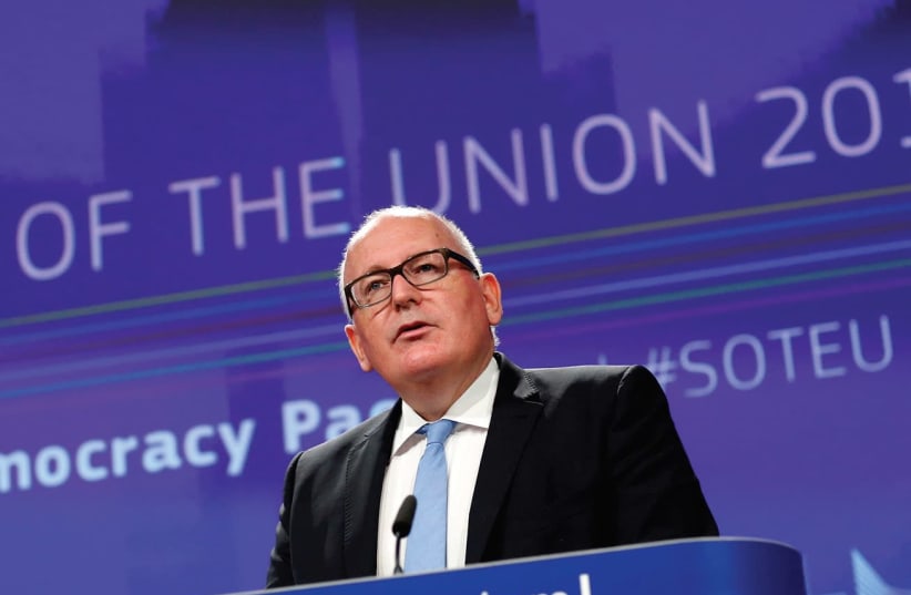 European Comission First Vice President Frans Timmermans addresses a news conference on the Democracy Package in Brussels in September (photo credit: REUTERS)