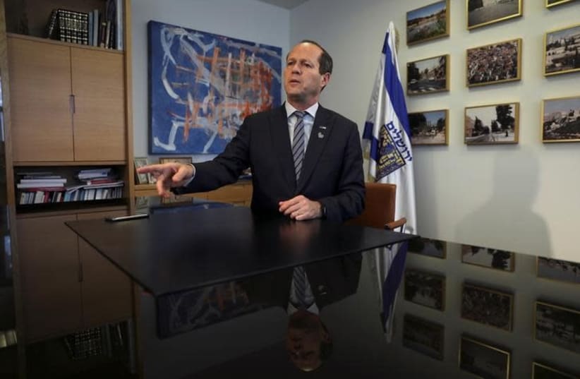 Nir Barkat, the mayor of Jerusalem, speaks during his interview with Reuters in his office at the Jerusalem Municipality April 24, 2017 (photo credit: REUTERS/Ronen Zvulun)