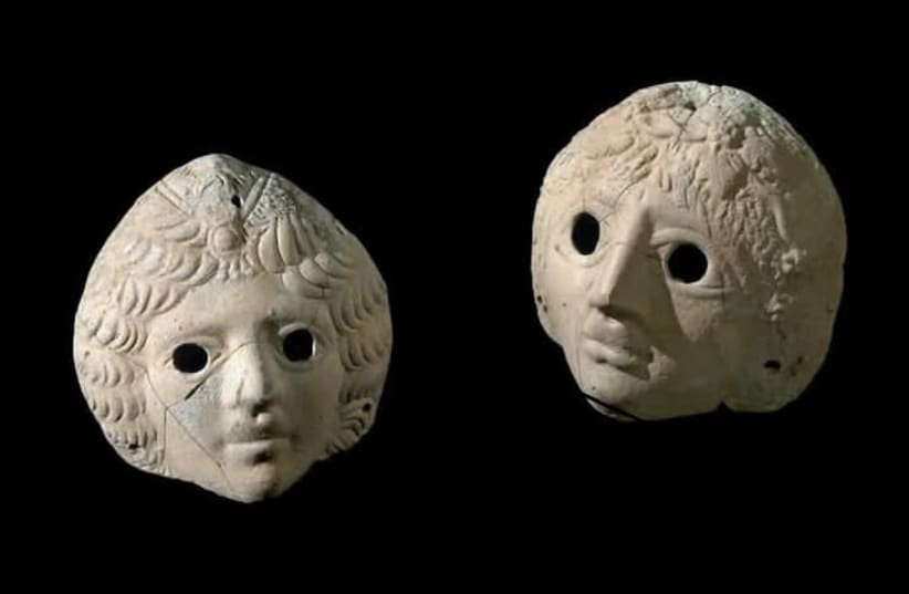 Masks of Dionysus and Ariadne uncovered at the Castra site. (photo credit: CLARA AMIT/IAA)