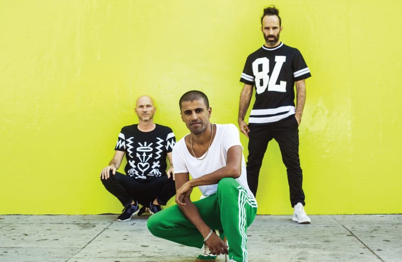 'In every album album, we give ourselves the license to address the things we are going through in the moment and also push the envelope of what’s expected of us,' says Balkan Beat Box saxophonist Ori Kaplan (left), seen here with the rest of the band (photo credit: ZIV SADE)