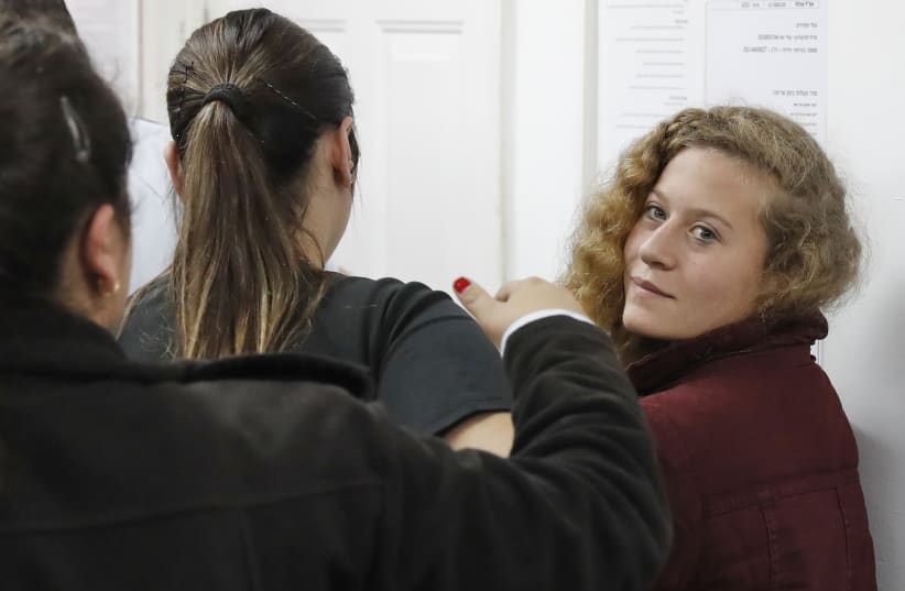 Ahed Tamimi appears at a military court at the Israeli-run Ofer prison in the West Bank village of Betunia on December 20, 2017. (photo credit: AHMAD GHARABLI / AFP)