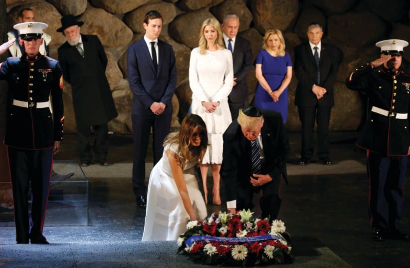 US PRESIDENT Donald Trump and First Lady Melania lay a wreath in the Hall of Remembrance at Yad Vashem in Jerusalem during a ceremony in May commemorating the Holocaust as Jared Kushner and his wife Ivanka, and PM Benjamin Netanyahu and his wife, Sara, look on (photo credit: JONATHAN ERNST / REUTERS)