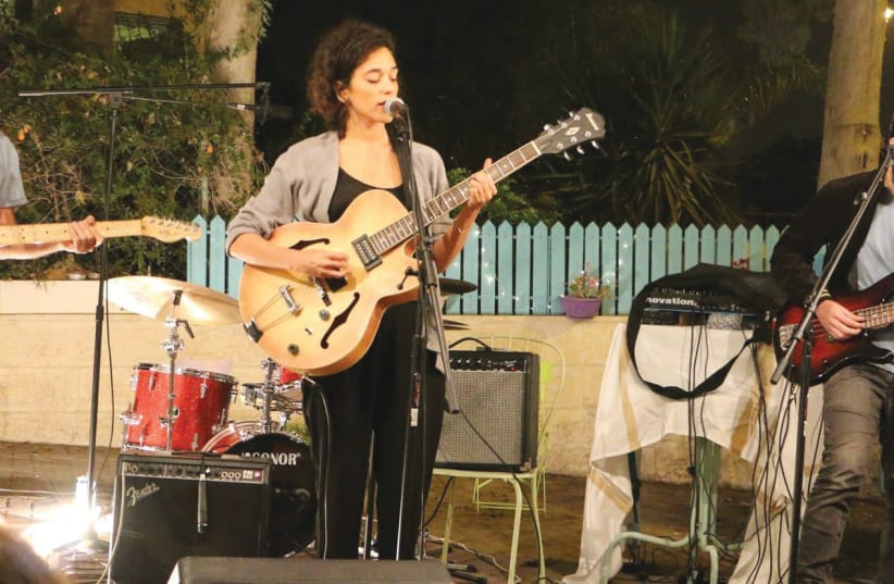 The group Folly Tree performs outdoors at a recent Sofar Sounds concert in Jerusalem (photo credit: WARREN BURSTEIN)