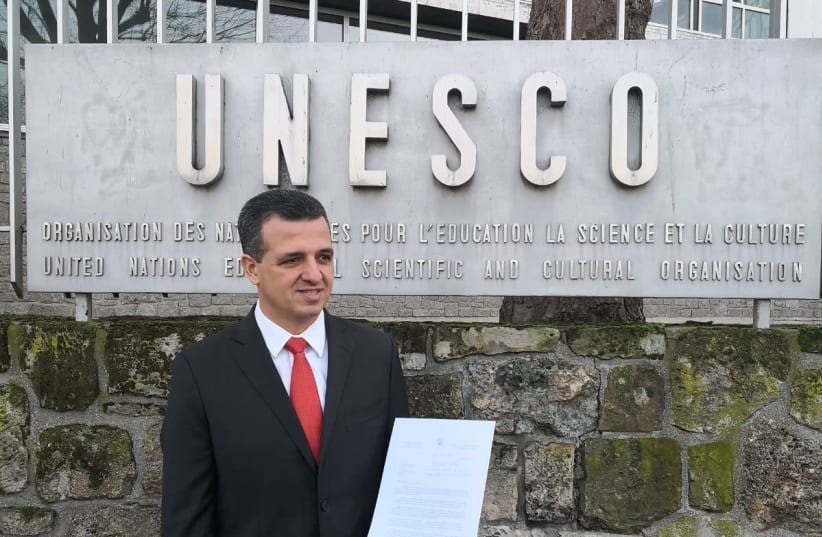 Carmel Shama-Hacohen standing in front of the UNESCO office with the unaccepted letter  (photo credit: ISRAELI DELEGATION TO UNESCO)