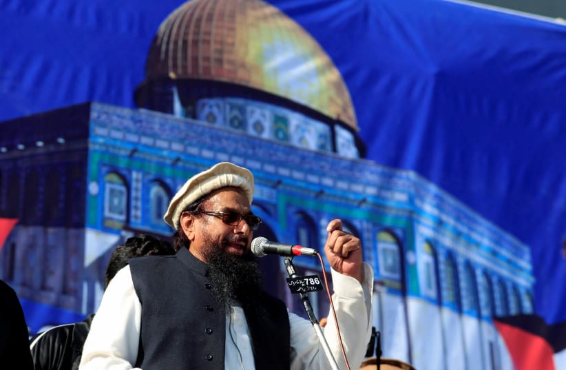 Hafiz Muhammad Saeed (C), chief of the Islamic charity organisation Jamaat-ud-Dawa (JuD), speaks to supporters during a gathering to protest against Trump's decision to recognise Jerusalem as the capital of Israel, in Rawalpindi, Pakistan December (photo credit: REUTERS/FAISAL MAHMOOD)