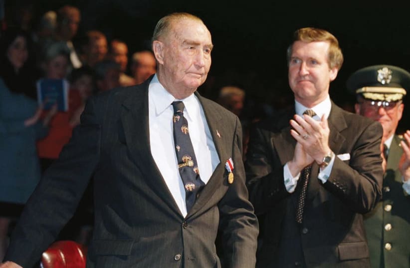 FORMER US SENATOR Strom Thurmond (left) is applauded at a ceremony in his honor in 1997. (photo credit: LUC NOVOVITCH/REUTERS)