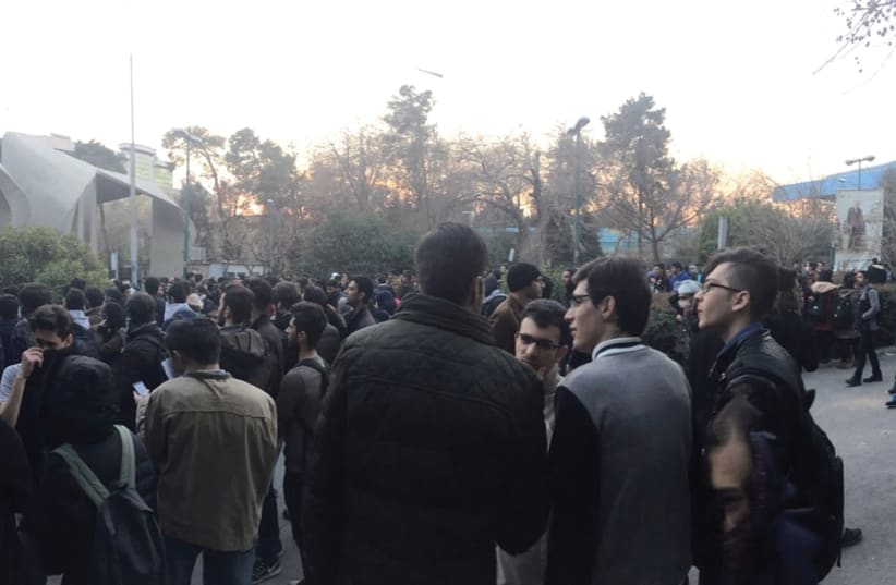 PROTESTERS ARE SHOWN near the University of Tehran on Saturday in a photo obtained from social media. (photo credit: REUTERS)