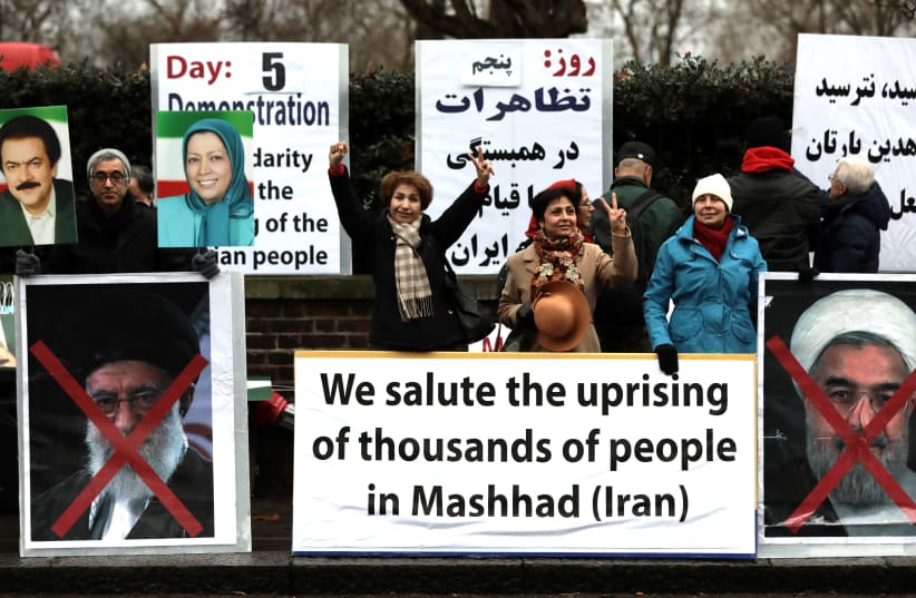 Opponents of Iranian President Hassan Rouhani hold a protest outside the Iranian embassy in west London, Britain, January 2, 2018. (photo credit: SIMON DAWSON/ REUTERS)