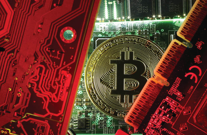 le bitcoin, une nouvelle monnaie virtuelle (photo credit: DADO RUVIC/REUTERS)