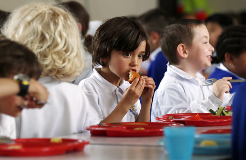 Students eating lunch at school (illustrative) (photo credit: REUTERS)