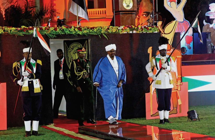 SUDAN’S PRESIDENT Omar Al Bashir arrives to address the nation during its 62nd Independence Day celebrations at the Palace in Khartoum last month. (photo credit: MOHAMED NURELDIN/REUTERS)