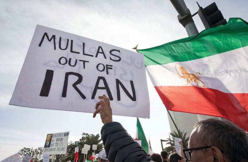 PEOPLE RALLY in support of Iranian anti-government protests in Los Angeles earlier this week (photo credit: MONICA ALMEIDA/REUTERS)