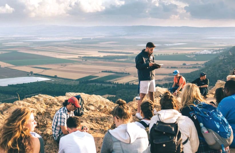 American Christian college students in Israel as part of a program aimed at Christian students, called Passages, visit the holy site of the Mount Precipice in the Galilee town of Nazareth. (photo credit: PASSAGES)