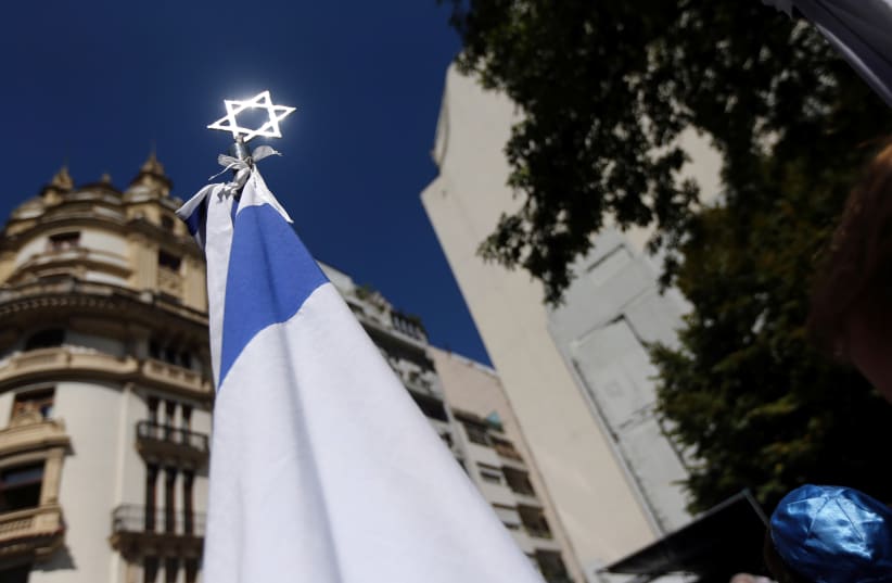 A Star of David is seen outside the former Israeli embassy in Buenos Aires, Argentina at an event to commemorate the 25th anniversy of the building's destruction by a car bomb, March 2017 (photo credit: REUTERS/MARCOS BRINDICCI)