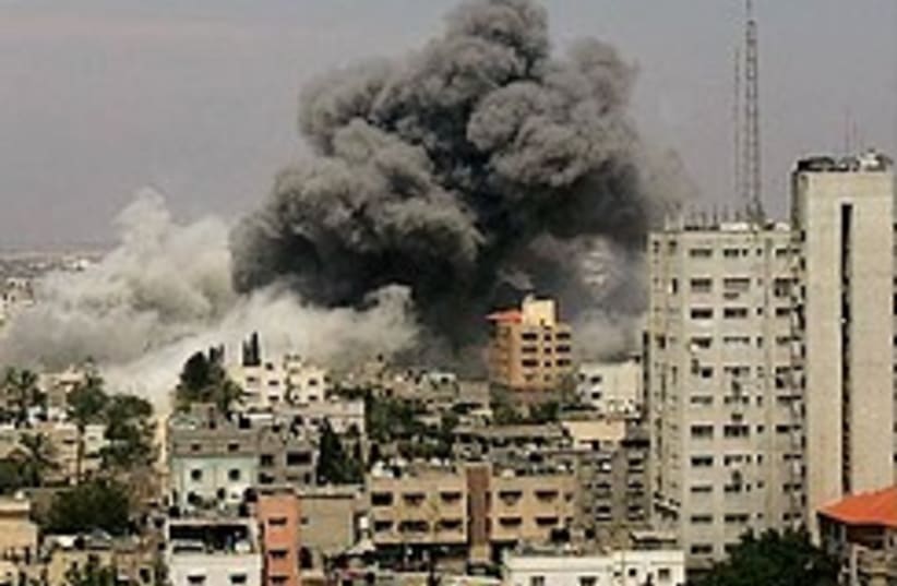 The aftermath of an IAF strike in Gaza (photo credit: AP)