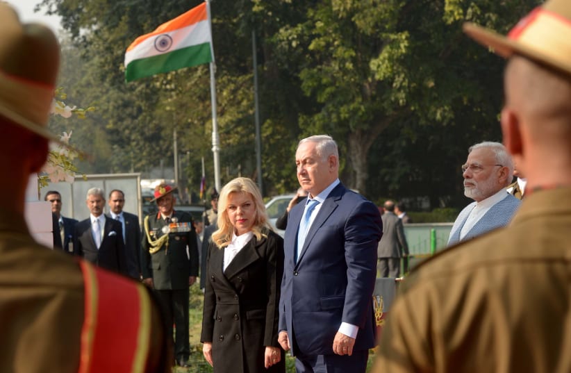 Prime Minister Benjamin Netanyahu and wife Sara at a World War I memorial for Indian soldiers killed in the battle for Haifa, January 14, 2018 (photo credit: AVI OHAYON - GPO)