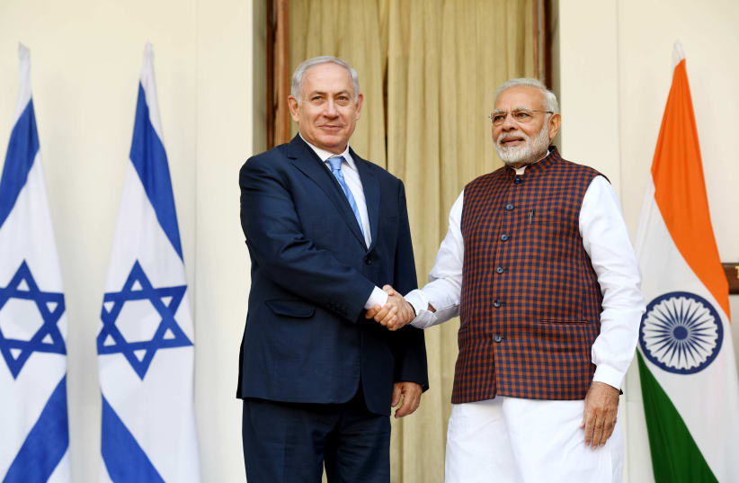 Israeli PM Netanyahu and Indian PM Modi shake hands at a press conference in New Delhi. (photo credit: AVI OHAYON - GPO)