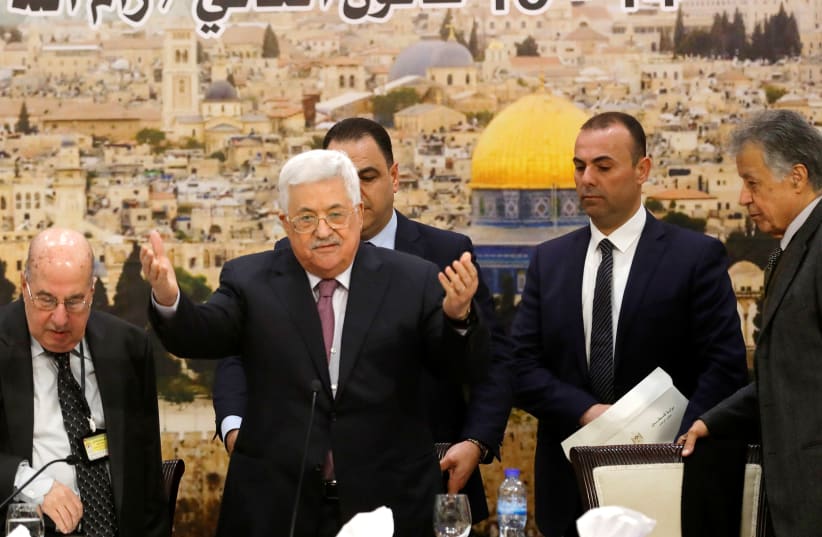 Palestinian President Mahmoud Abbas arrives to attend the meeting of the Palestinian Central Council in the West Bank city of Ramallah January 14, 2018.  (photo credit: REUTERS/MOHAMAD TOROKMAN)