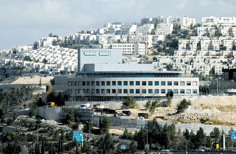 A TEVA Pharmaceutical Industries building is seen in Jerusalem last year. (Ammar Awad/Reuters) (photo credit: AMMAR AWAD / REUTERS)