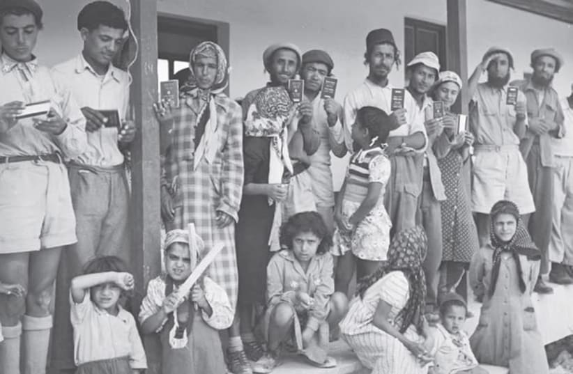 YEMENITE FAMILIES are shown in 1951 at Givat Ye’arim, a moshav just west of Jerusalem, whose initial residents arrived in Israel as part of the airlift of Jews from Yemen. (GPO) (photo credit: GPO)