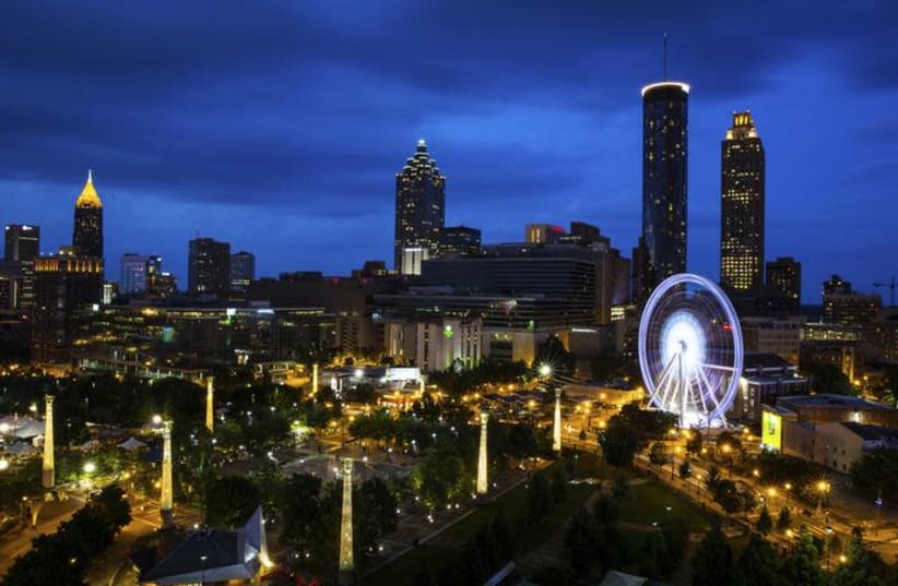 SkyView Atlanta, a 200-foot (61-meter) tall Ferris wheel with 42 gondolas, is seen on the South end of Centennial Park in downtown Atlanta, Georgia July 19, 2013. (photo credit: CHRIS ALUKA BERRY/ REUTERS)