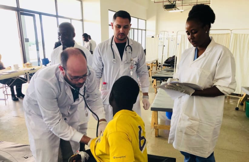 Medical professionals from Sheba Medical Center and Zambia work together to treat a child as part of their joint efforts to combat the current African Cholera outbreak (photo credit: Courtesy)