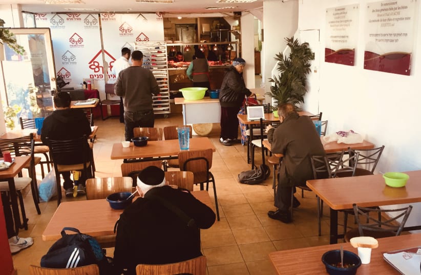 The foundation of the Meir Panim nonpro t’s food services is its network of free restaurants in cities throughout Israel, designed to look and feel like any other restaurant (photo credit: MAAYAN HOFFMAN)