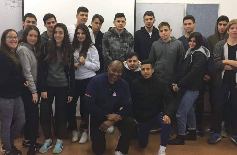 Murray with 10th and 11th graders at Dekel Vilnai High School in Ma’aleh Adumim (photo credit: YOSEF MURRAY)