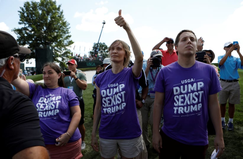 Protesters wearing anti-Trump shirts the presidents misogyny. (photo credit: REUTERS)