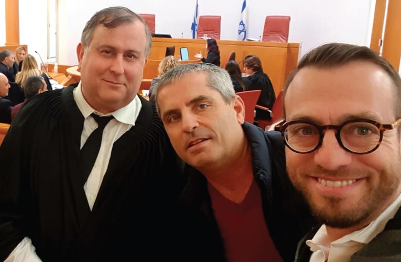 Nachman Rosenberg (right) and Eitan Zeliger (center) pose with Prof. Aviad Hacohen, who is representing Shabbat Team in the petition (photo credit: SHABBAT TEAM)