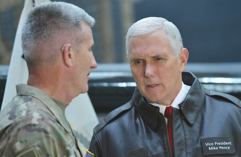  US Vice President Mike Pence (right) chats with Gen. Nick Nicholson, commander of US forces in Afghanistan, shortly after arriving at Bagram Air Field in December (photo credit: MANDEL NGAN/POOL/REUTERS)