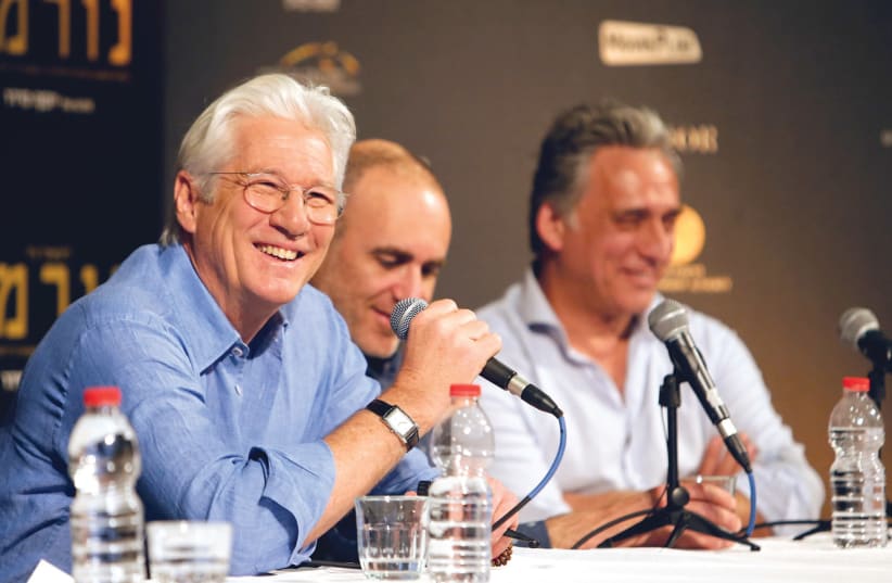 Actor Richard Gere left), director Joseph Cedar (center) and actor Lior Ashkenazi hold a news conference following the screening of the film ‘Norman: The Moderate Rise And Tragic Fall Of A New York Fixer’ at the Jerusalem Cinematheque in Jerusalem last March (photo credit: NIR ELIAS / REUTERS)