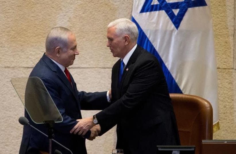 US Vice President Mike Pence shakes hands with Israeli Prime Minister Benjamin Netanyahu ahead of his address to the Knesset, Israeli Parliament, in Jerusalem January 22, 2018 (photo credit: REUTERS/ARIEL SCHALIT/POOL)